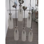 A set of six frosted glass 'milk bottle' ceiling pendant lights