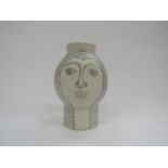 An Arabia ceramic vase designed by Gunvor Olin-Gronqvist with hand drawn faces, printed mark to