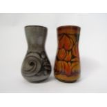 Two Poole Aegean pattern vases in ochre and red and grey and black. Impressed and incised marks to