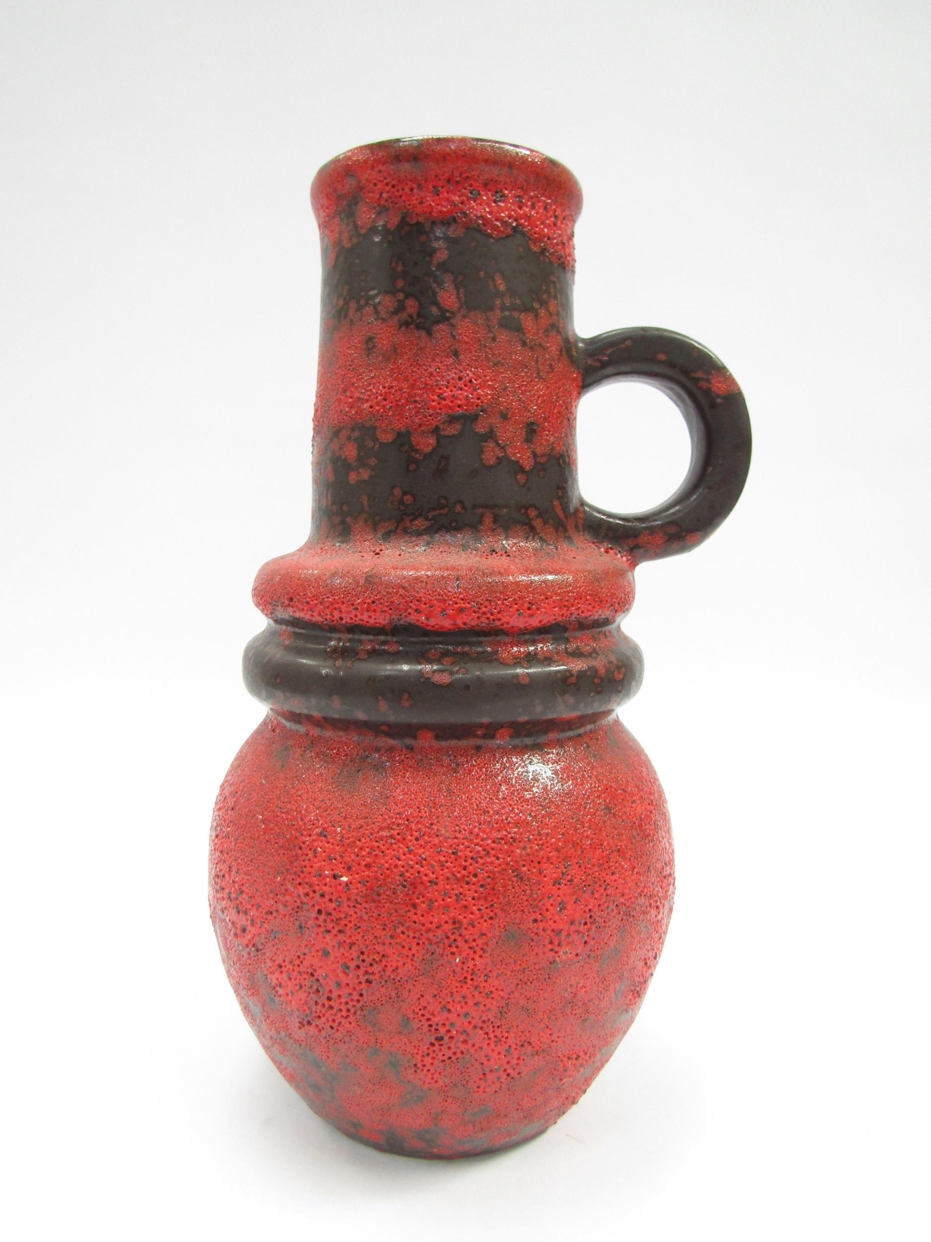 A West German Scheurich vase with single handle and hooped centre in fat lava red and black glaze, - Image 2 of 3