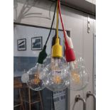 Fifteen globe pendant lights with various colored leads by 'Muuto'