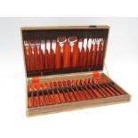 A vintage Dutch stainless steel full canteen of cutlery with wooden handles in original box. Box