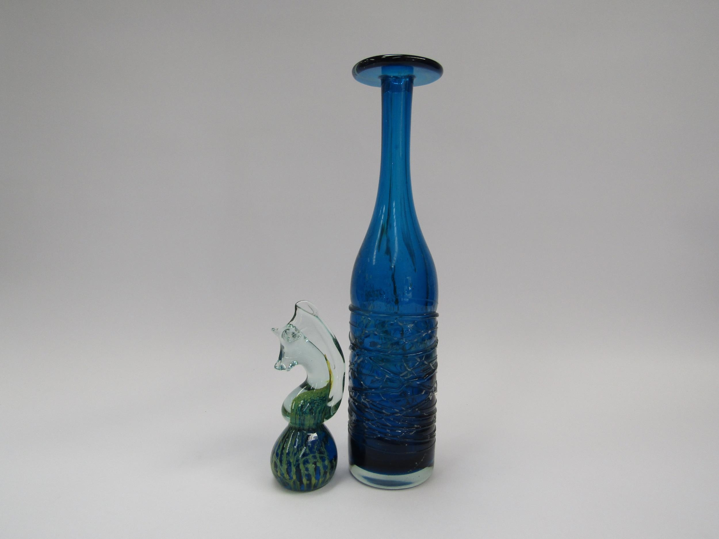A tall Mdina Glass bottle vase with flared rim and a Mdina glass paperweight in the form of a