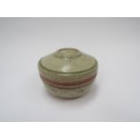 RICHARD BATTERHAM (1936-2021): A studio pottery stoneware lidded pot in green and brown ash glaze,