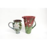 A Janice Tchalenko Dartington Pottery large poppy jug and a Chelsea Pottery floral jug. Tallest 25cm