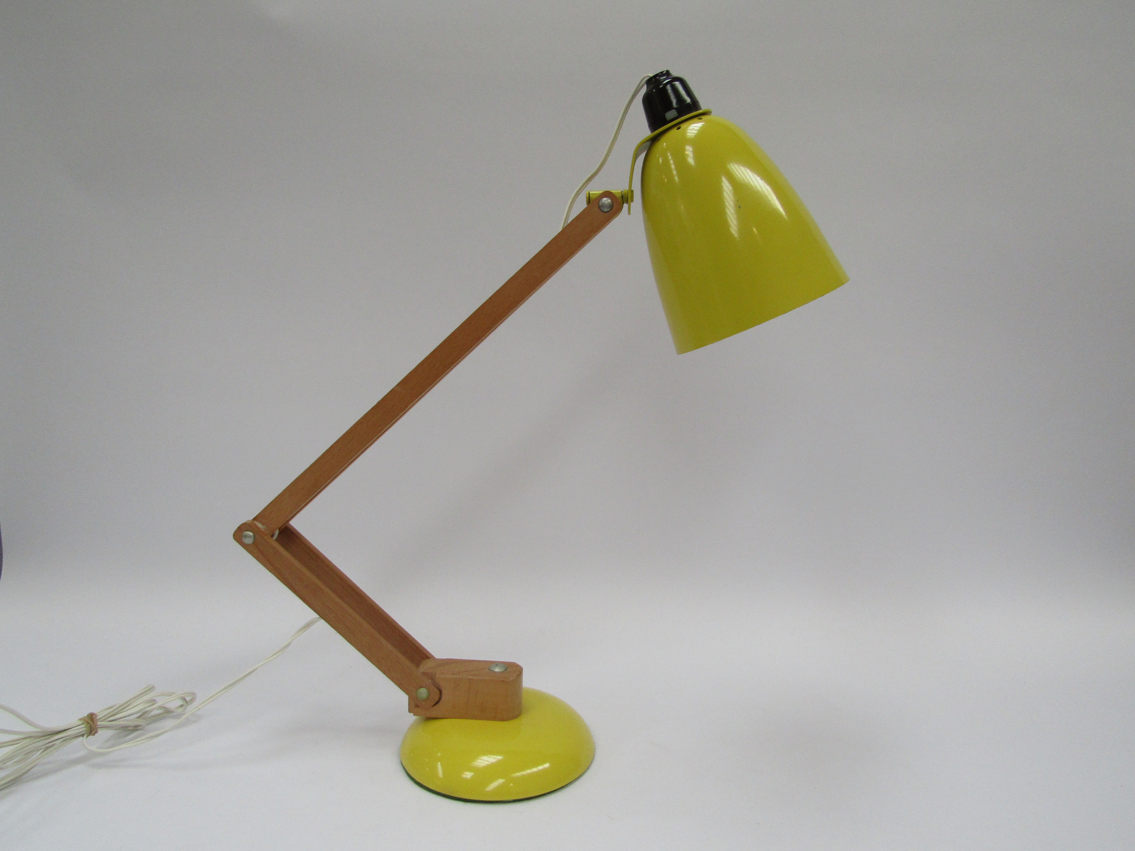 A Maclamp in yellow (wooden arms) designed by Terence Conran for Habitat. Fitted with LED bulb
