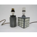 Two Poole pottery small lamp bases in grey and white with relief moulded detail. Tallest excluding