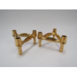 A pair of Nagel gold tone interlocking candle holders
