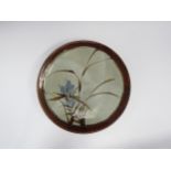 Large studio pottery dish with blue flowers and grass design. 37.5cm diameter