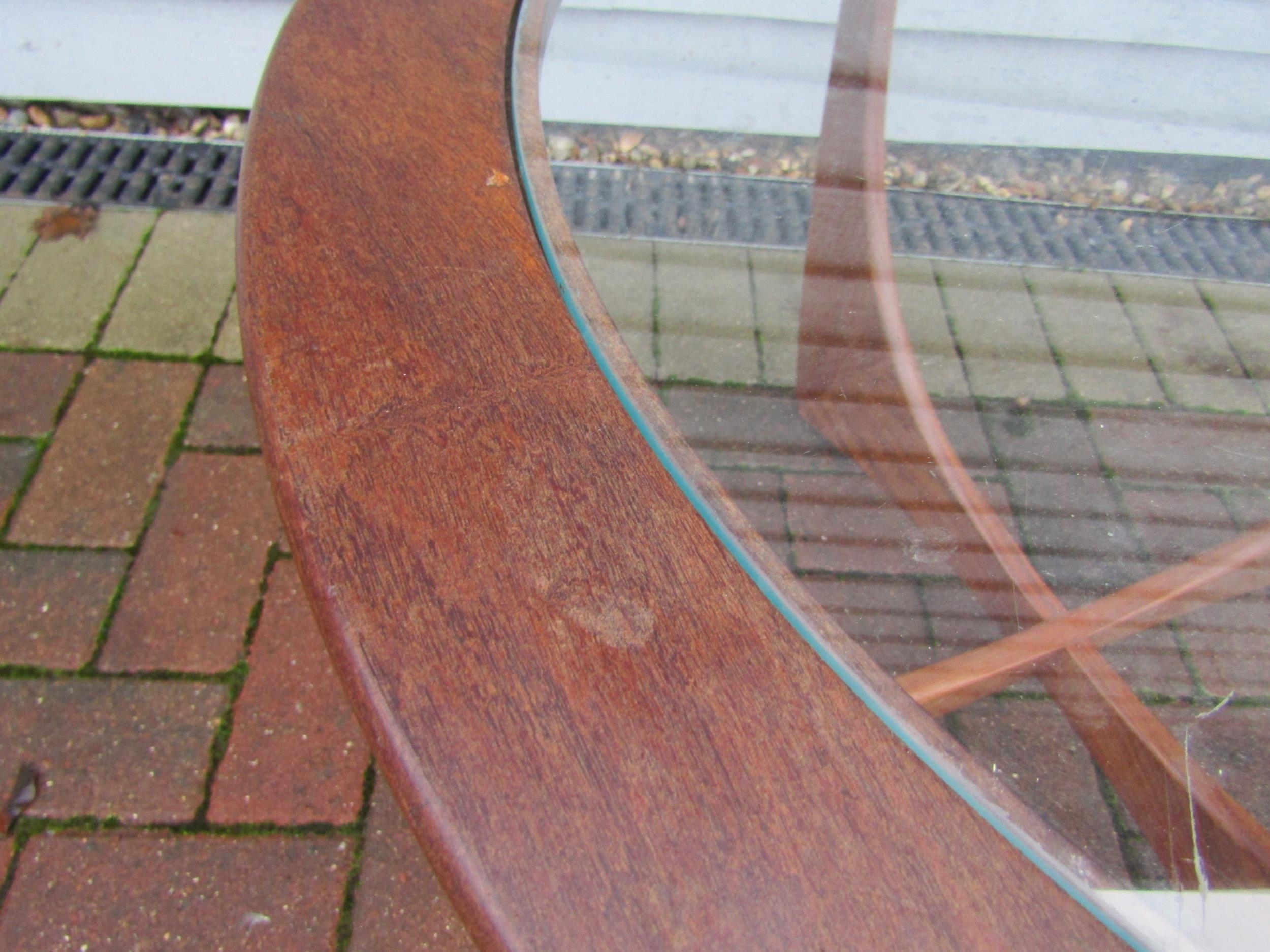 A G-Plan circular Astro table in teak and clear glass. 84cm diameter x 46cm high - Image 2 of 9