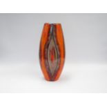 A modern Poole Pottery large vase with eliptical pattern in reds and orange colours, designed by