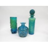Three pieces of Mdina glass consisting of bark effect cylindrical vase, another and a decanter, blue