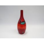 A modern Poole Pottery bottle form vase, 'Volcano' range in reds, ornage and blue. 27.5 cm high