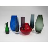 A collection of Whitefriars glass vases in various colours and shapes including optic, soda etc.