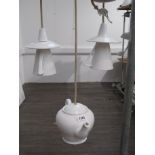 A novelty porcelain ceiling light in the form on a teapot in white glaze, together with a pair of