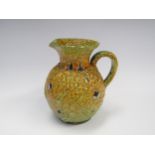 A French Mid 20th Century Le Cyclope studio ceramic jug by Charles Cart with yellow and green "
