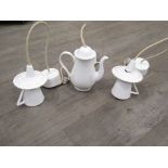 A novelty porcelain ceiling light in the form of a coffee pot in white glaze, together with a pair