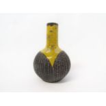 A Poole Pottery stoneware vase by Guy Sydenham in black relief and yellow glaze. Impressed and