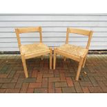 A pair of Vico Magistretti designed rush seated chairs, beech frames, made for Habitat