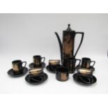 A 1960's Portmeirion coffee set, black and gold Pheonix pattern, designed Susan Williams-Ellis,