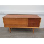 A Mid 20th Century side cabinet with four teak drawers, light oak finish fall front with shelved