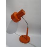 An orange Pifco adjustable desk lamp, model 986.