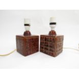 A pair of Poole Pottery 'Helios' pattern table lamp bases by Robert Jefferson, treacle glazed. 11.