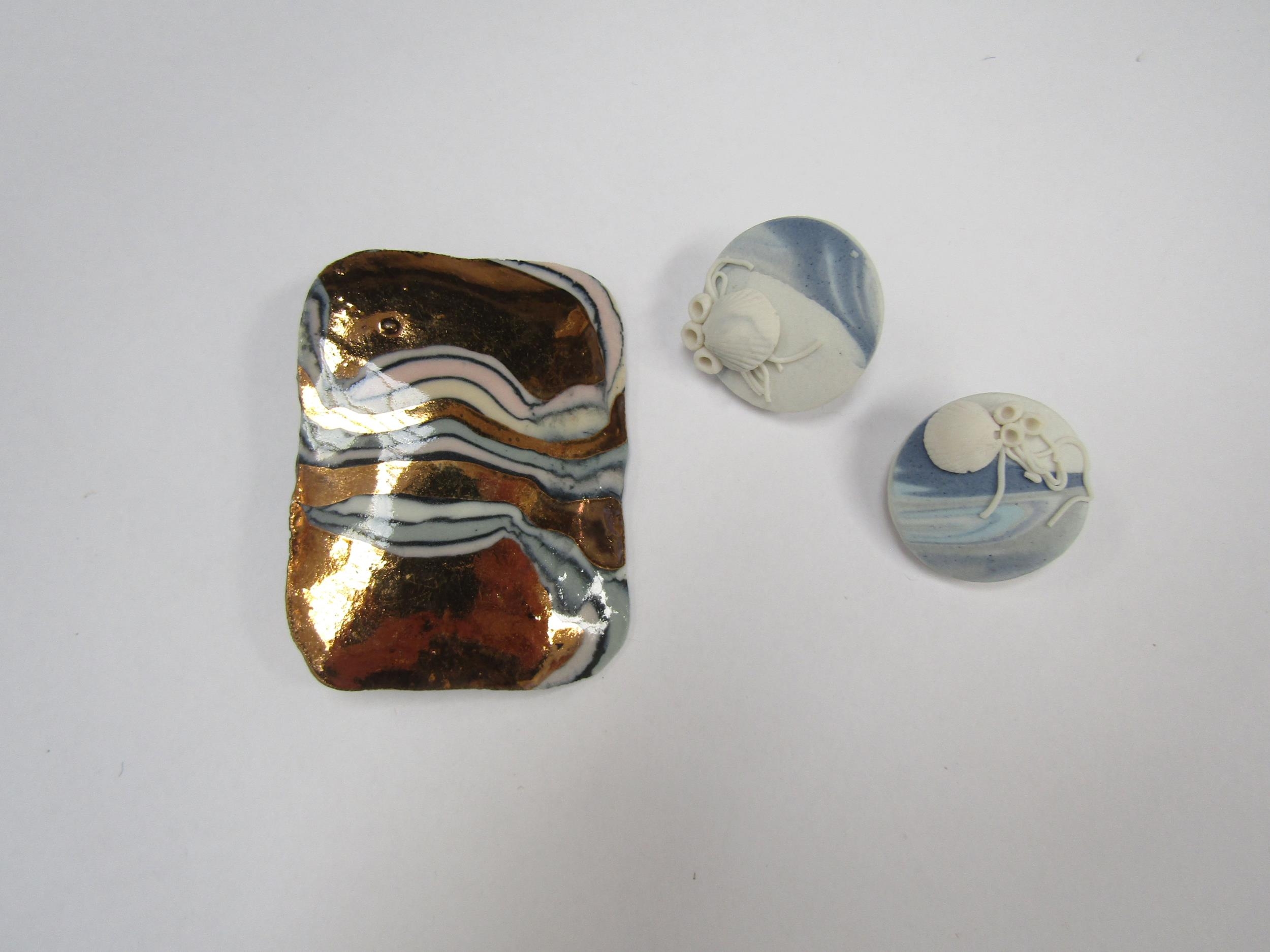 Shape Scape ceramic earrings by Elaine Dick MA, along with a large porcelain gold luster brooch