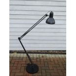 A floor standing angle poised adjustable lamp in black