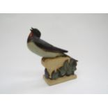 A Bing and Grondahl stoneware figure of a Swallow designed by Karl Otto-Johansen, No.7033 to base,
