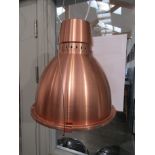 A pair of anodized copper finish pendant lights, one with no glass and dented 34cm diameter