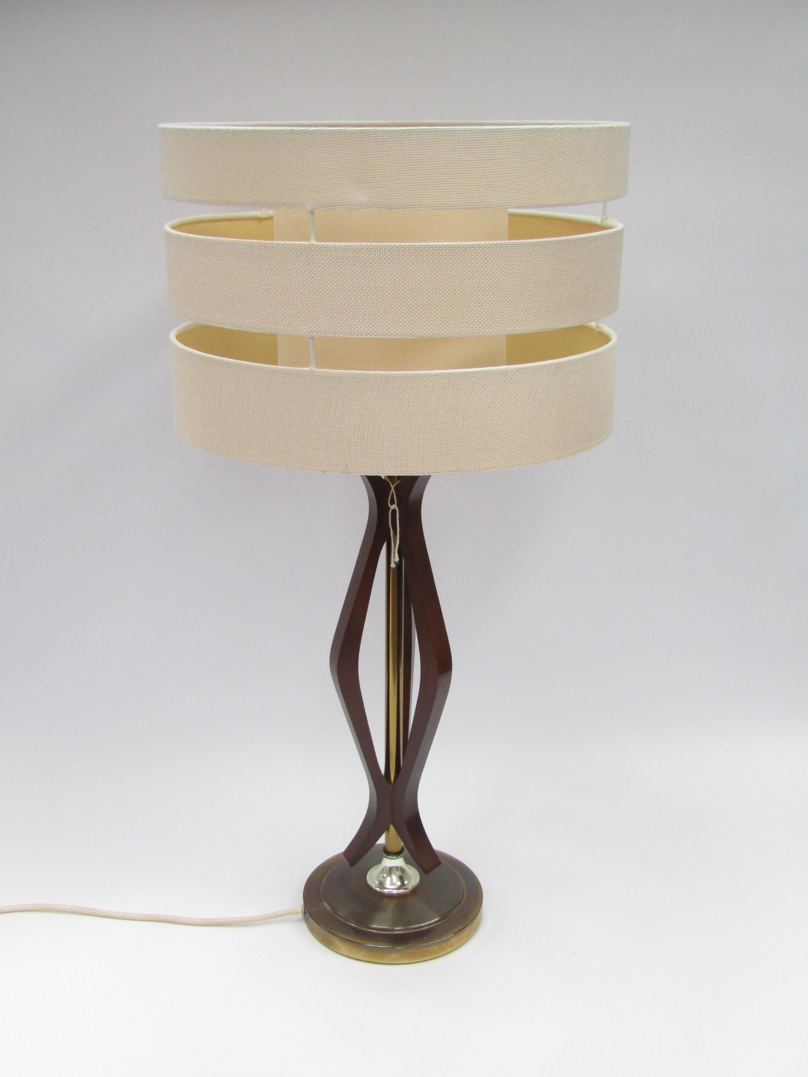 An original 1970's teak and brass metal lamp base and shade, 70cm high