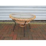A Franco Albani wicker, iron and glass coffee table. 67 x 50cm