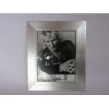 ROD STEWART: A framed publicity photograph signed and dedicated "To Jean, Be Lucky, Rod Stewart"