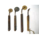 (Bookbinding). Four wooden handled brass finishing tools, including three fillet wheels. Provenance: