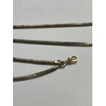 A gold guard chain, unmarked, 138cm long, 39g
