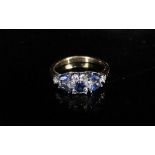 A gold sapphire and clear stone ring, unmarked. Size K/L, 2.9g