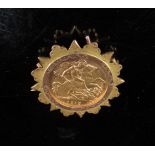 A 1912 gold half sovereign in brooch mount, stamped 9ct, 6g