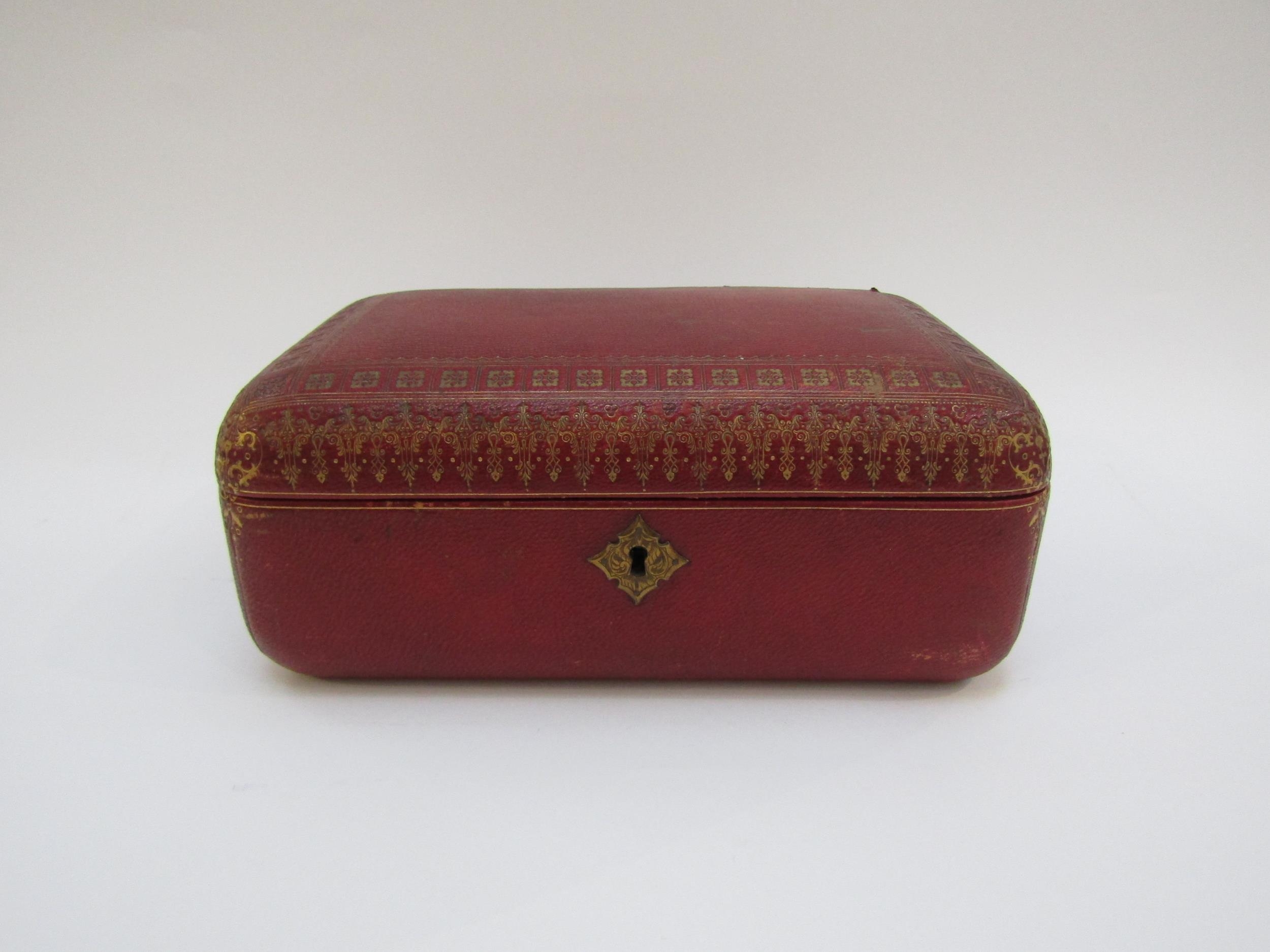 A 19th Century red leather casket with gilt tooled decoration to the exterior. With key. 27cm x 17cm - Image 2 of 22