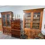 A pair of late Victorian oak cabinets, each with two door Art Nouveau lead glazed top with shelved
