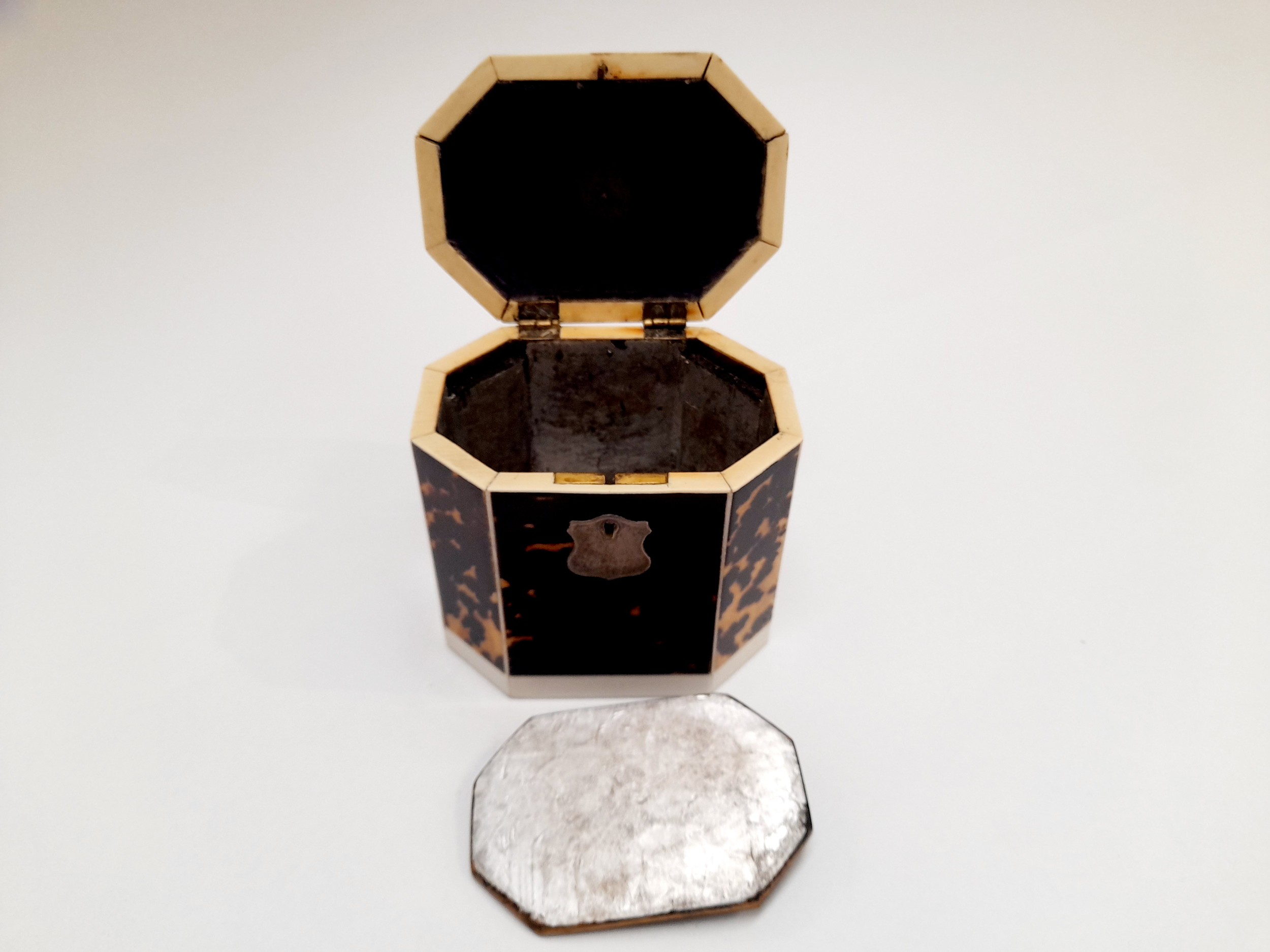 A Georgian tortoiseshell veneered tea caddy of canted rectangular form, with inner lid, ivory - Image 3 of 4