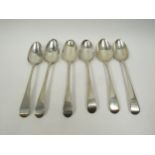 Six George III silver Fiddle pattern serving spoons all with crested handles including three by