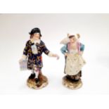 A pair of early 19th Century Derby porcelain figures, a lady with a basket and a gentleman ticket