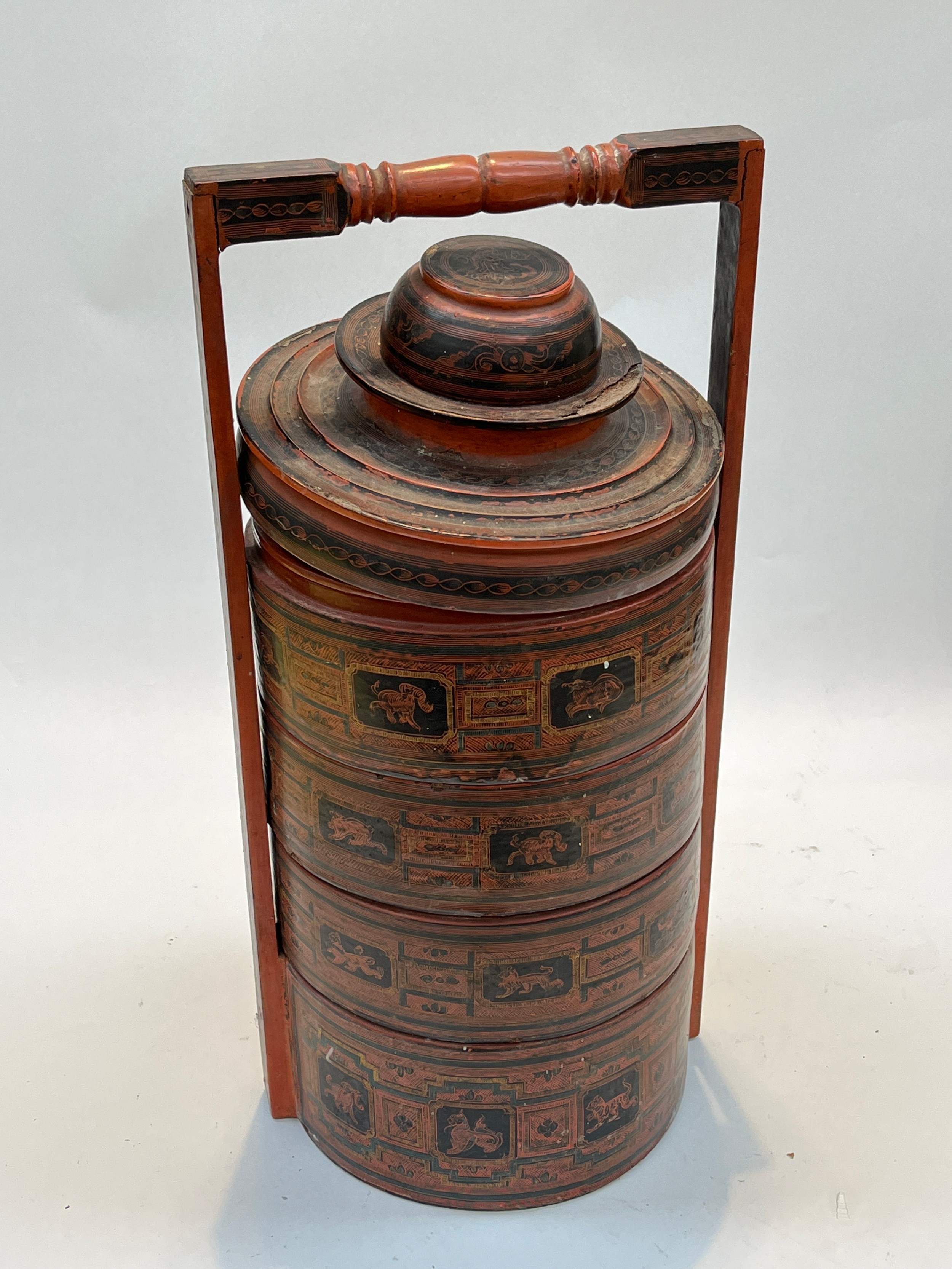 A Burmese lacquered tiffin box, multiple sections used for transporting food to the paddy fields