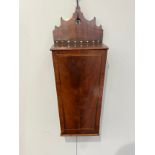 A George III crossbanded mahogany candle box of tapering form, fretwork top