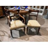 A set of eight William IV dining chairs with branch and leaf upholstery leaf form rosettes to top
