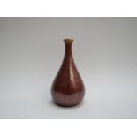 A Pilkington's Royal Lancastrian copper lustre bottle vase, 16.5cm tall