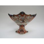 A 19th Century Japanese Imari deep boat-shaped pedestal bowl, lavishly decorated inside and out,