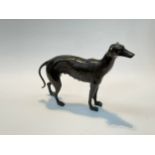 A cast iron sculptural figure of a greyhound with bronzed finish, 29cm x 35cm