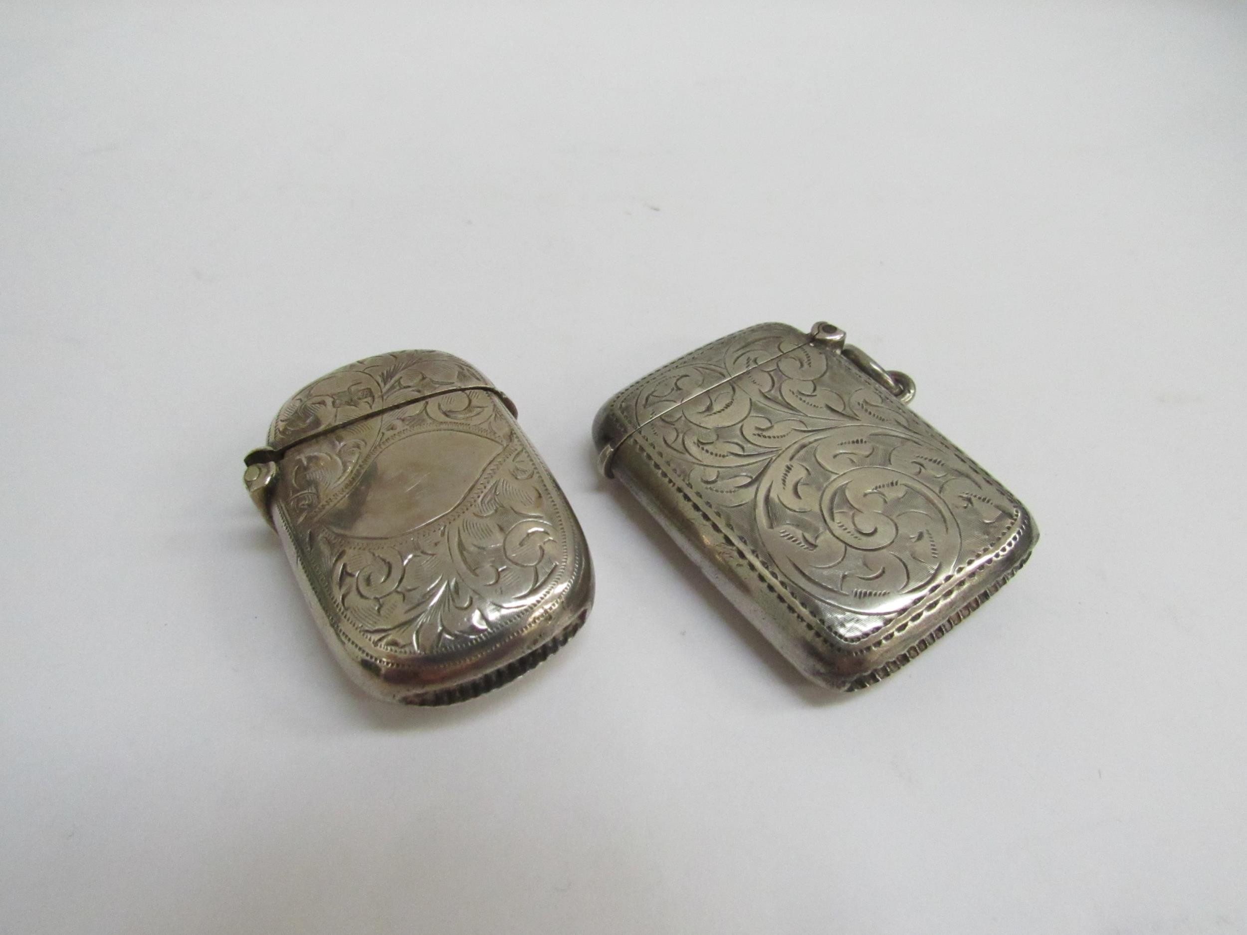 Two silver vestas with engraved decoration one "Emily to Will Christmas 1908"